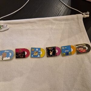 Disney Toy Story and Coco Trading Cards with Pink and Yellow Accents